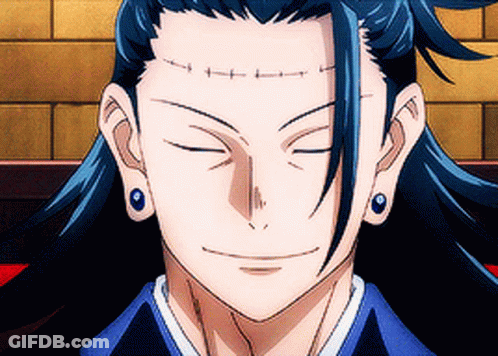 A Close Up Of A Person 'S Face With Their Eyes Closed And Earrings On . GIF