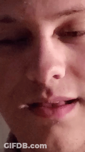 A Close Up Of A Person 'S Face With Their Eyes Closed And Mouth Open . GIF