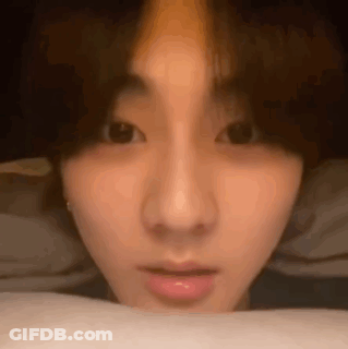 A Close Up Of A Person 'S Face With Their Eyes Closed And Their Mouth Open . GIF