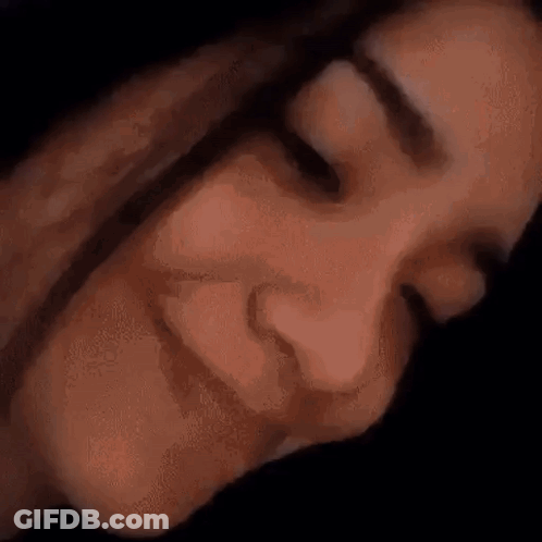 A Close Up Of A Person 'S Face With Their Eyes Closed . GIF