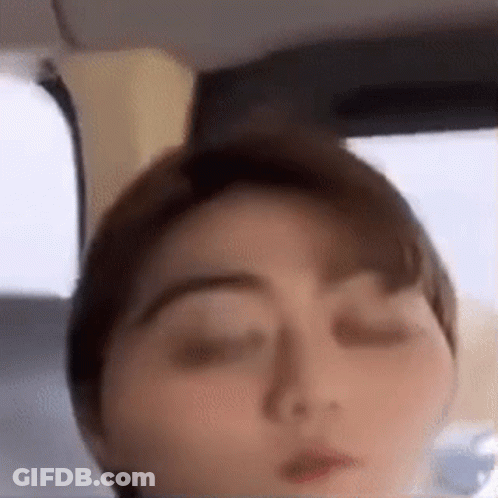 A Close Up Of A Person 'S Face With Their Eyes Closed . GIF