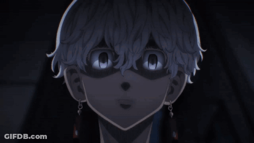 A Close Up Of A Person 'S Face With Their Eyes Glowing In The Dark GIF