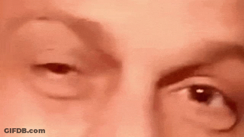 A Close Up Of A Person 'S Face With Their Eyes Open . GIF