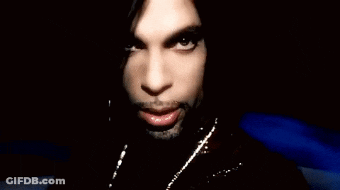 A Close Up Of A Person 'S Face With Their Hand In Front Of Their Mouth . GIF