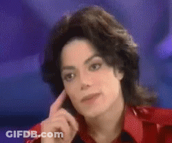 A Close Up Of A Person 'S Face With Their Hand On Their Ear . GIF