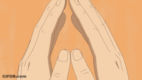 A Close Up Of A Person 'S Face With Their Hands Folded In Front Of Their Face . GIF