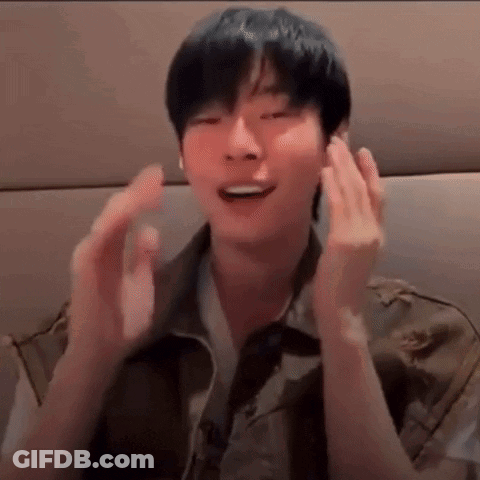 A Close Up Of A Person 'S Face With Their Hands In Front Of Their Face . GIF