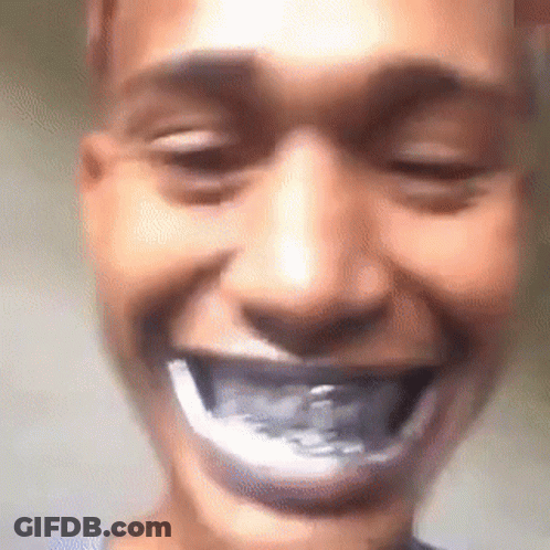 A Close Up Of A Person 'S Face With Their Mouth Open And A Toothbrush In It . GIF