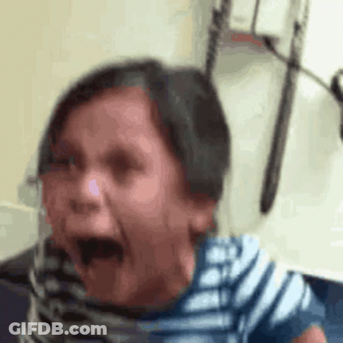A Close Up Of A Person 'S Face With Their Mouth Open And Their Eyes Closed . GIF