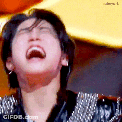 A Close Up Of A Person 'S Face With Their Mouth Open And Their Eyes Closed . GIF