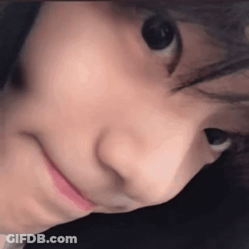 A Close Up Of A Person 'S Face With Their Mouth Open And Their Eyes Closed . GIF
