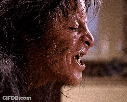 A Close Up Of A Person 'S Face With Their Mouth Open And Wet Hair GIF