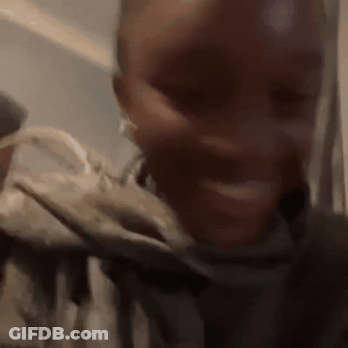 A Close Up Of A Person 'S Face With Their Mouth Open GIF