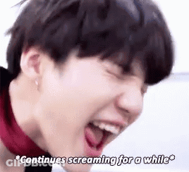 A Close Up Of A Person 'S Face With Their Mouth Open . GIF