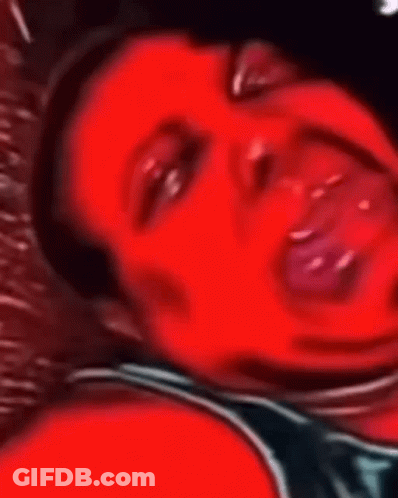 A Close Up Of A Person 'S Face With Their Mouth Open GIF