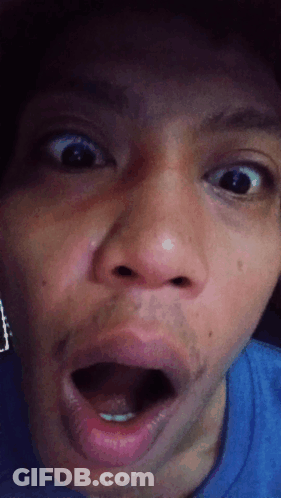 A Close Up Of A Person 'S Face With Their Mouth Wide Open GIF