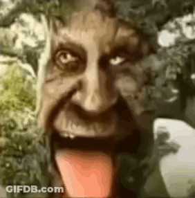 A Close Up Of A Person 'S Face With Their Tongue Hanging Out . GIF