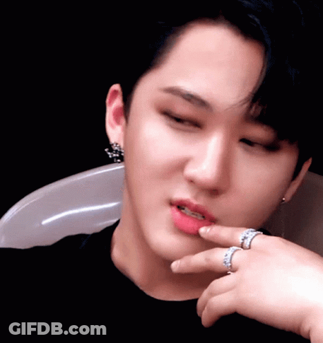 A Close Up Of A Person 'S Face With Two Rings On Their Finger GIF
