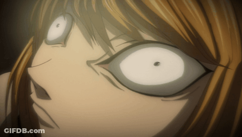 A Close Up Of A Person 'S Face With White Eyes And A Black Spot In The Middle GIF