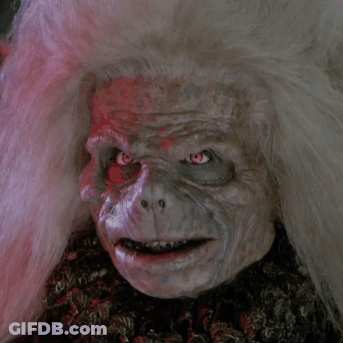 A Close Up Of A Person 'S Face With White Hair GIF