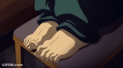 A Close Up Of A Person 'S Feet Sitting On A Stool GIF