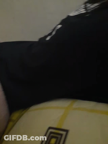 A Close Up Of A Person 'S Feet With A Black Shirt That Says ' Lg ' On It GIF