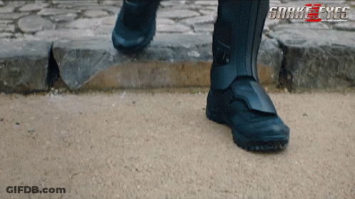 A Close Up Of A Person 'S Feet With The Words Snake Eyes On The Bottom Right GIF