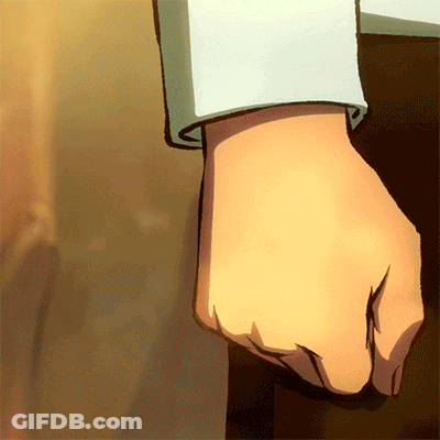 A Close Up Of A Person 'S Fist Against A Wall GIF