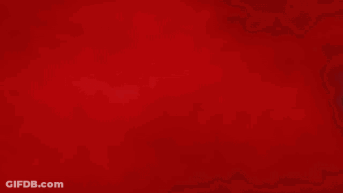 A Close Up Of A Person 'S Fist With A Red Background GIF