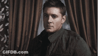 A Close Up Of A Person 'S Fist With A Wedding Ring On Their Finger . GIF