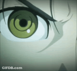 A Close Up Of A Person 'S Green Eye With A Black Pupil . GIF
