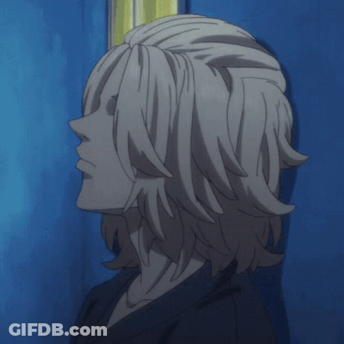 A Close Up Of A Person 'S Hair Against A Blue Wall GIF