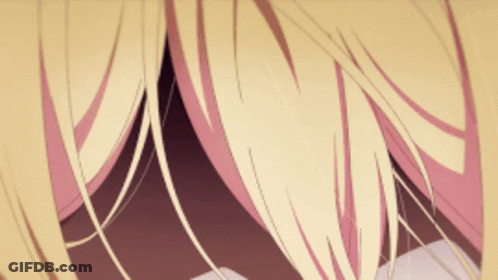 A Close Up Of A Person 'S Hair With A Pink Stripe GIF