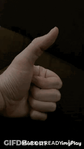 A Close Up Of A Person 'S Hand Giving A Thumbs Up With The Words Mark U Readyim Play Below It GIF