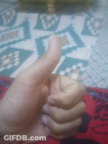 A Close Up Of A Person 'S Hand Giving The Thumbs Up GIF