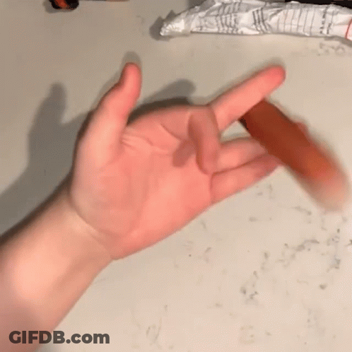 A Close Up Of A Person 'S Hand Holding A Stick GIF