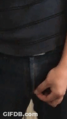 A Close Up Of A Person 'S Hand Holding A Zipper On A Pair Of Jeans GIF