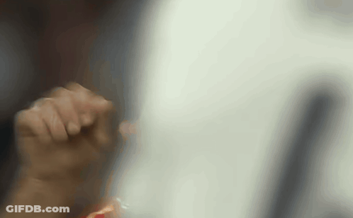 A Close Up Of A Person 'S Hand Holding Something In Their Hand . GIF