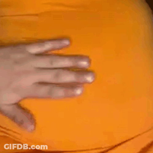 A Close Up Of A Person 'S Hand On A Yellow Item . GIF