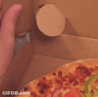 A Close Up Of A Person 'S Hand Reaching For A Pizza In A Box GIF