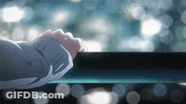 A Close Up Of A Person 'S Hand Reaching Out To Touch A Railing . GIF