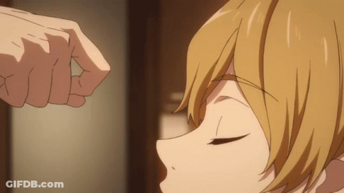 A Close Up Of A Person 'S Hand Touching Another Person 'S Head GIF