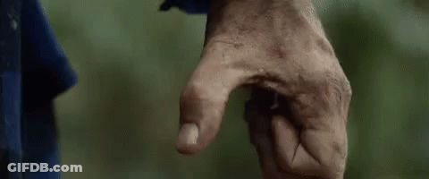 A Close Up Of A Person 'S Hand With A Dirty Thumb Pointing At Something . GIF