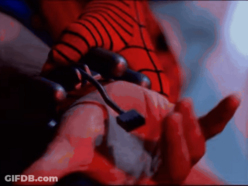 A Close Up Of A Person 'S Hand With A Red Spider Web On It GIF