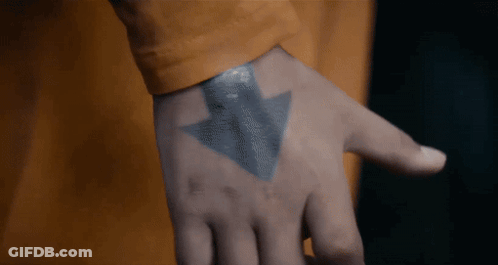 A Close Up Of A Person 'S Hand With A Tattoo Of An Arrow Pointing Upwards GIF