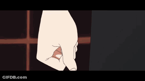 A Close Up Of A Person 'S Hand With A White Shirt And Black Skirt GIF
