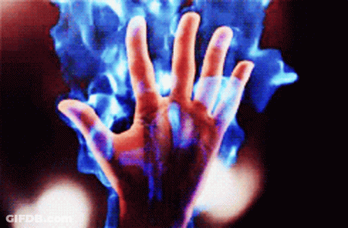 A Close Up Of A Person 'S Hand With Blue Flames Coming Out Of It 'S Fingers GIF