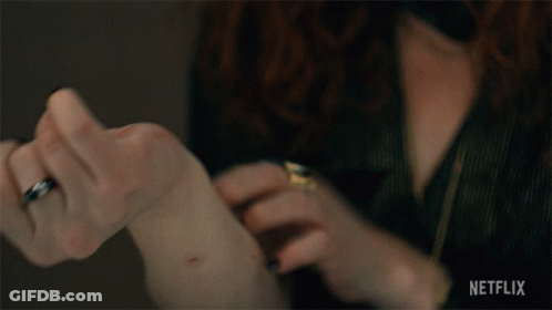 A Close Up Of A Person 'S Hand With Netflix Written On The Bottom Right GIF