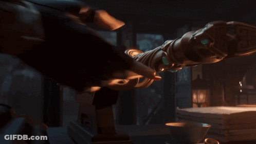 A Close Up Of A Person 'S Hands Holding A Metal Object That Looks Like A Sword GIF