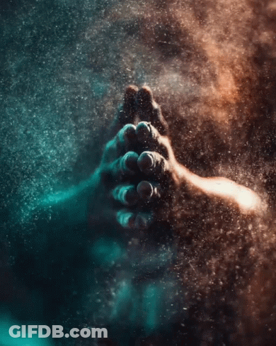 A Close Up Of A Person 'S Hands In A Dark Room GIF